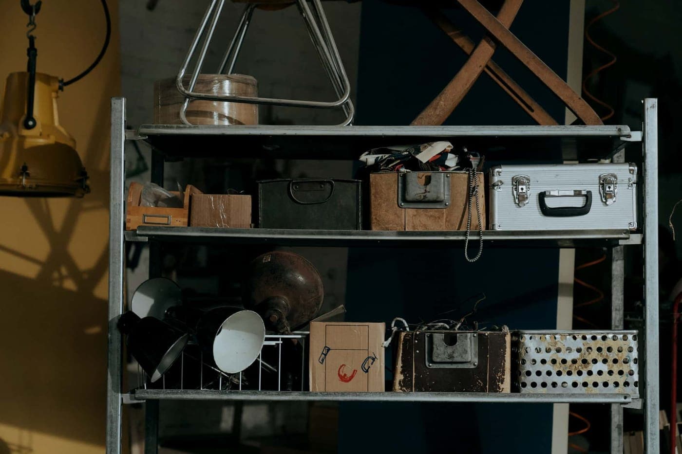 Metal shelving units holding boxes in a garage