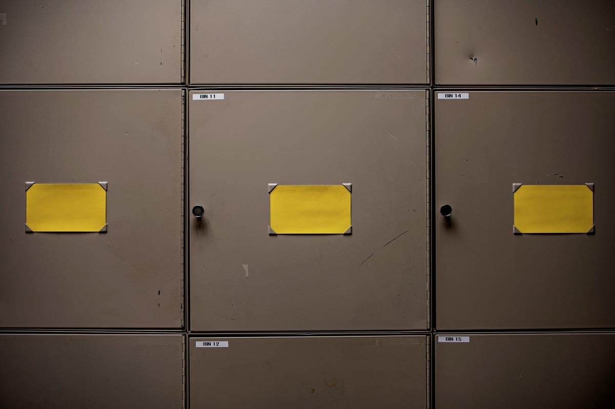 Steel storage lockers with printed bin number labels on each door
