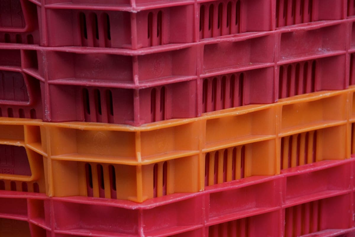 Stacked plastic storage crates in several sizes