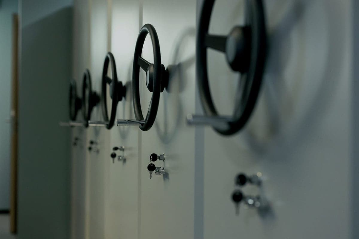 Metal garage storage cabinets with closed doors along a wall