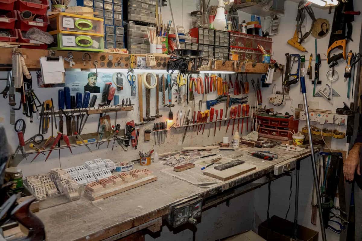A sturdy workbench with a wooden top in a workshop