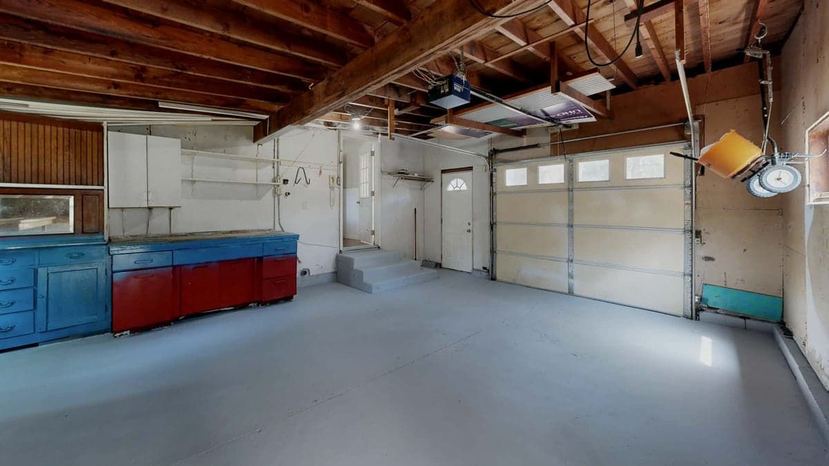 A run of garage cabinets along a workshop wall