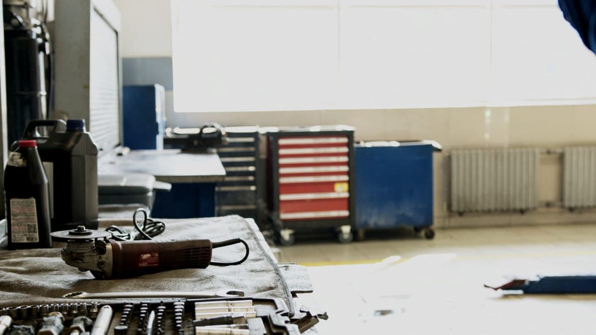 A steel tool cabinet and workbench in a working garage