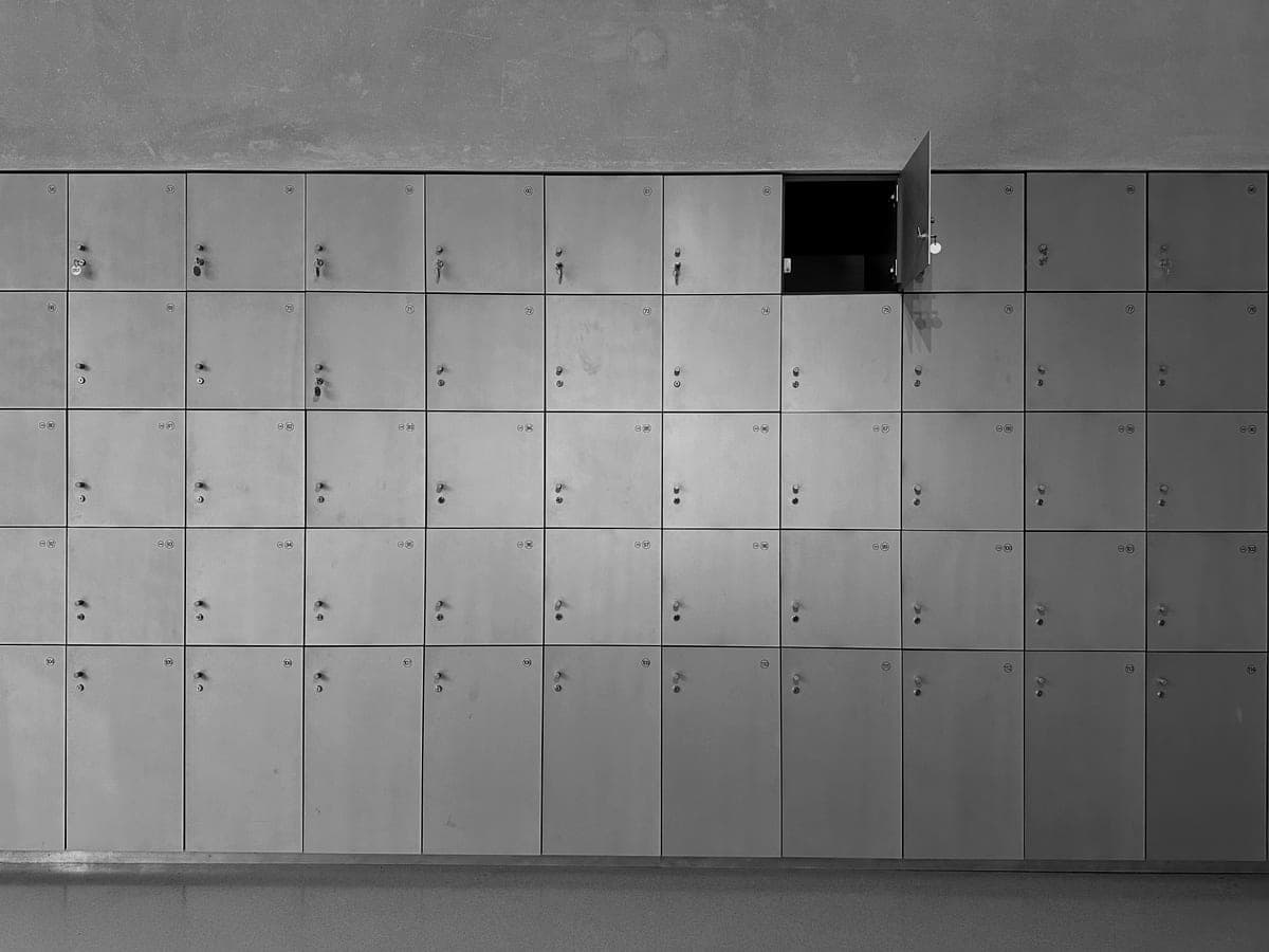 A wall of gray steel cabinets with one door standing open