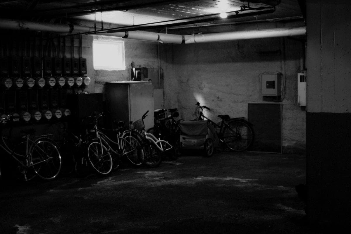 Bicycles stored off the floor in a basement storage area