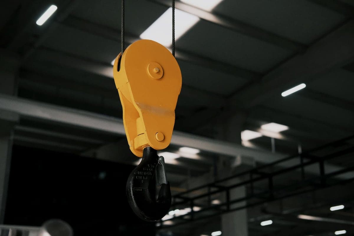 A ceiling-mounted lifting mechanism with pulleys in a garage