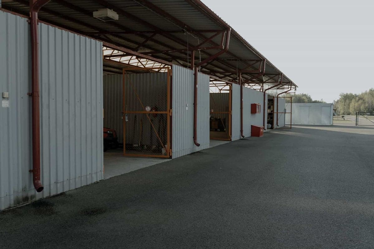 The interior of a garage door with its track and opener assembly overhead
