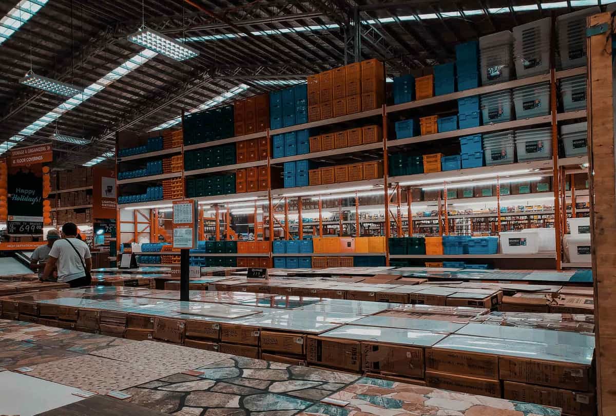 A retail aisle of steel shelving units on display