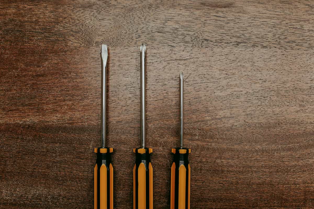 Steel hand tools arranged on a workshop surface